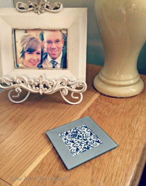 Put pretty scrapbook paper in photo coasters to add interest to your decor via ComeHomeForComfort.com